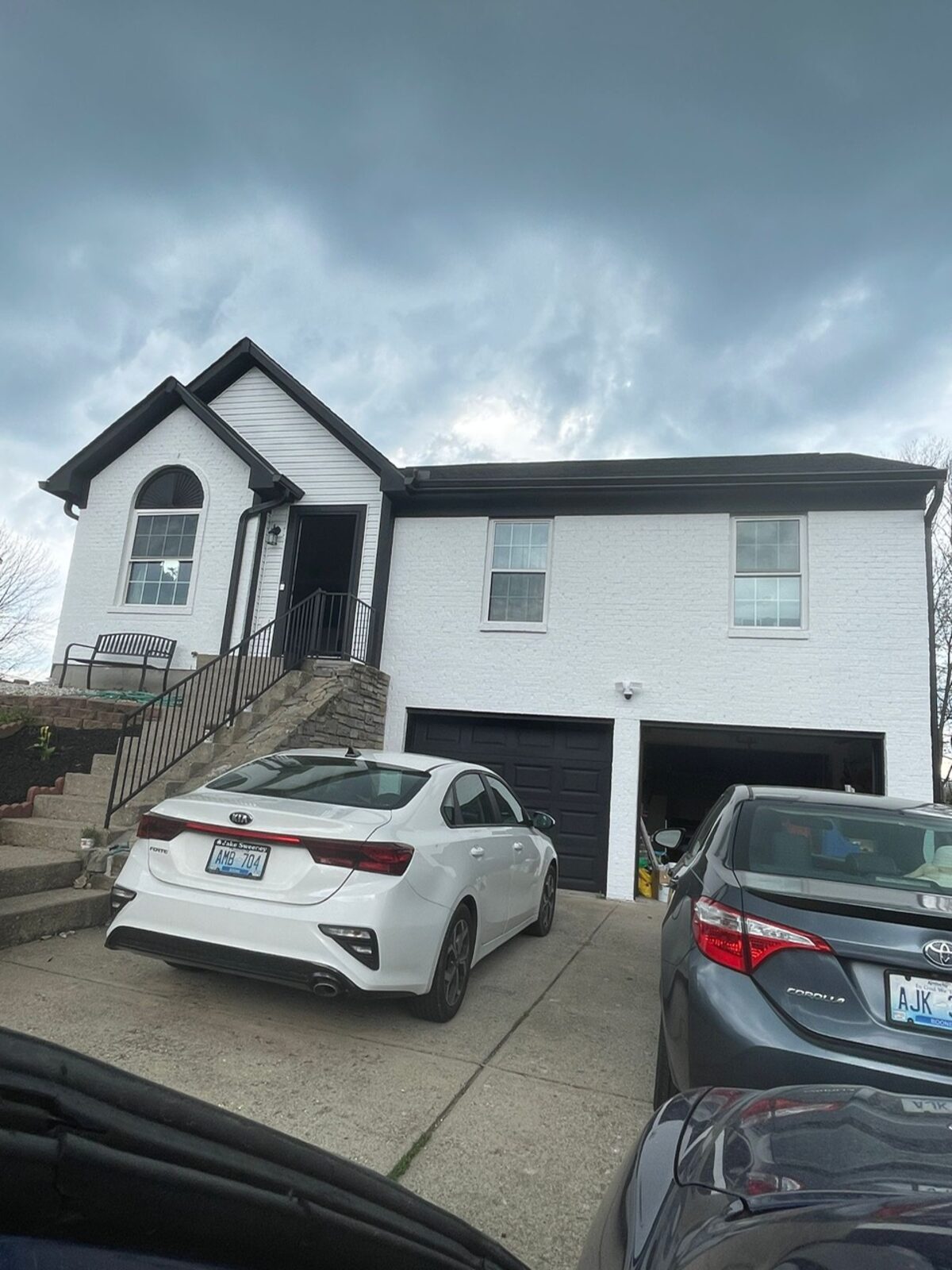 White brick exterior with black trim